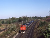 Hyde Park/Denfield Road - most of us know this location.
I had the wife drop me off while she ran some errands and I was rewarded with a hastily borrowed GP40-2W on VIA's Windsor train 73 this day. The steam generator car is keeping the travellers comfortable on the early fall morning. Obviously something was amiss with older covered wagons that day but looking back, I'm not complaining now !