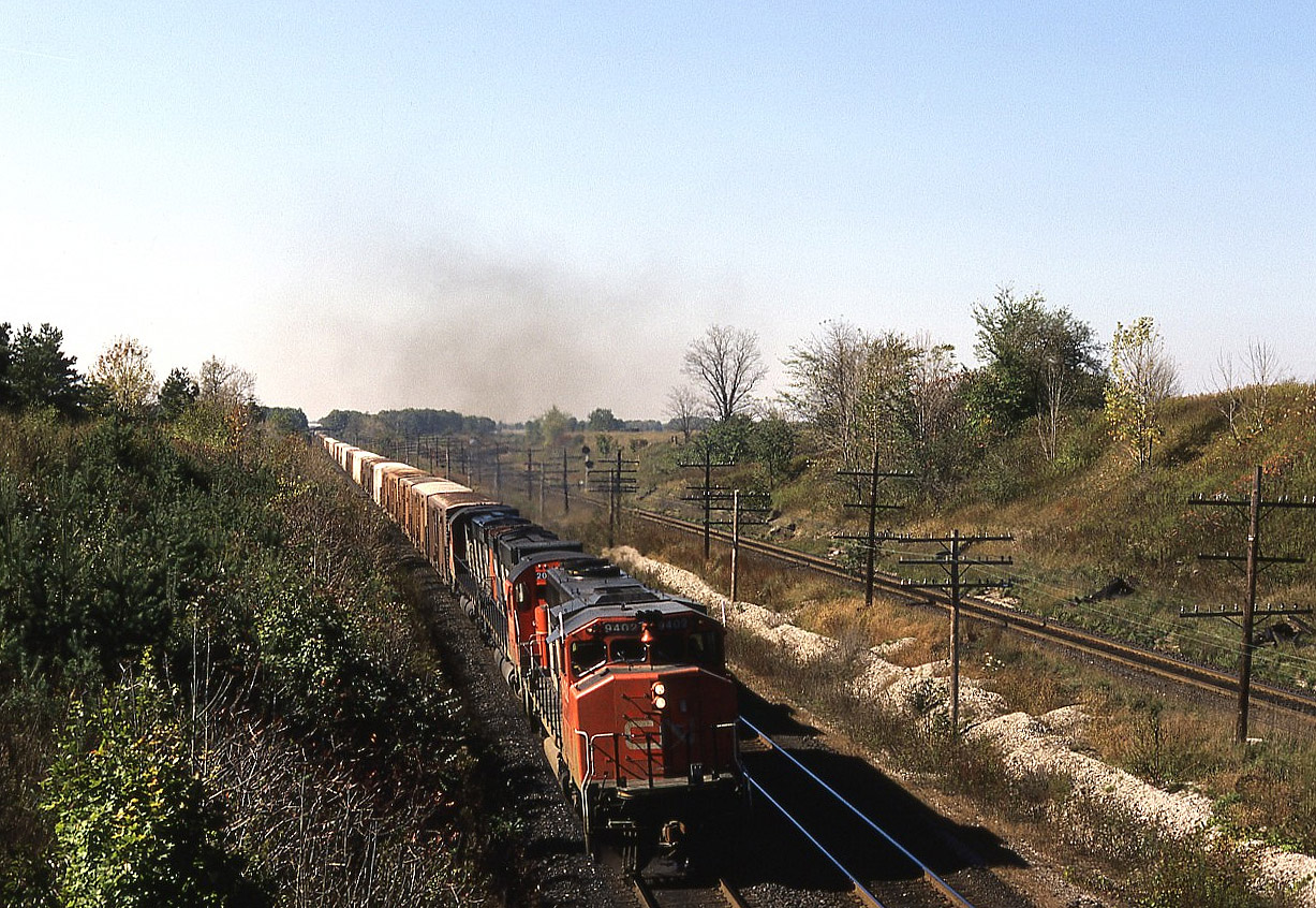 Uva per Vino !
Early October and the California wine grapes are flooding the Toronto and Montreal markets. 9402 and a pair of C630's have several thousand tons of SPFE/UPFE reefers behind them, hurrying the tender fruit to the various brokers. No doubt this was probably a second section of train 392. The earlier dedicated Chicago-Toronto hotshot  very likely had it's share of concord and chardonnay.