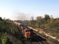 Uva per Vino !
Early October and the California wine grapes are flooding the Toronto and Montreal markets. 9402 and a pair of C630's have several thousand tons of SPFE/UPFE reefers behind them, hurrying the tender fruit to the various brokers. No doubt this was probably a second section of train 392. The earlier dedicated Chicago-Toronto hotshot  very likely had it's share of concord and chardonnay. 