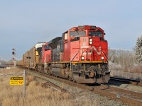SD70M-2 CN 8806 and DASH 8-40CW 2164 (ex BNSF) head an eastbound train of auto racks onto the second main line at Ardrossan