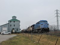 CP 235 flies past the old silo in the hamlet of Elmstead which is part of Lakeshore, Ontario. SOO 6027 is one of 3 SOO SD60(M) units still out on the road, along with 6053 and 6061. 