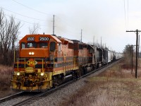 Even on a dreary afternoon it is hard to bypass a mainline train with a GP35 leading. It appears once again one of the SD40s is out of service again, and veteran GP35 #2500 has been called to fill in. There has been a lot of talk lately about the future retirement of the trailing SD45T-2 "tunnel motor" but for now it seems to be one of the railroads most reliable locomotives. Goodrich-Exeter train 431 is seen here leaving Acton and about to cut through "Rock Cut" just west of town on its way back to Stratford. 