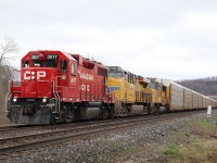 A somewhat rare CP GP38AC is seen leading train 244 with a Union Pacific ES44AC and SD70M trailing. The train is seen just about to duck under CN's Halton sub. leaving the Niagara Escarpment in the distance.