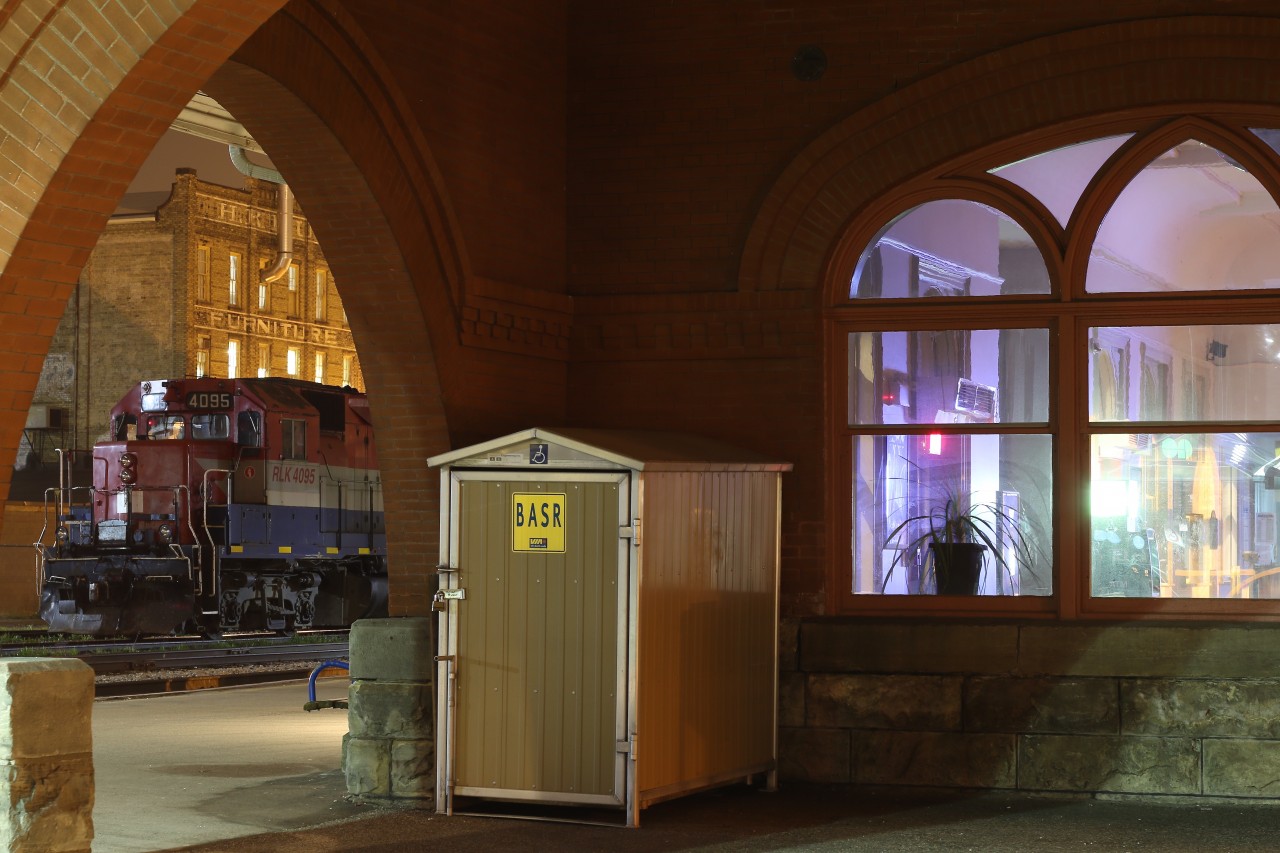 It's almost 2:30 in the morning and all is quiet at the shared VIA/GO station in Kitchener. The indoor and outdoor lighting highlights the turn of the century architecture that is a big part of old Kitchener. Goodrich - Exeter train #580s power sits quietly infant of the station after returning from a trip up to Elmira only an hour earlier. In a few short hours the station will be bustling with activity as Toronto bound commuters fill the platform.