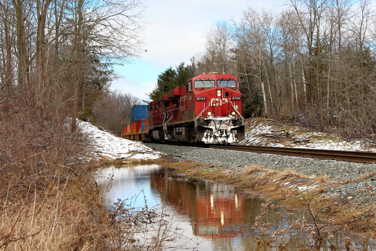 With all the rain and snow we had the last few days, I find myself standing in four inches of water to get this shot. At least the sun was shining today. CP 246 led by CP 8744 with CP 9821 make their way south on the Hamilton sub on their way to Kinnear Yard.