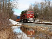 With all the rain and snow we had the last few days, I find myself standing in four inches of water to get this shot. At least the sun was shining today. CP 246 led by CP 8744 with CP 9821 make their way south on the Hamilton sub on their way to Kinnear Yard.