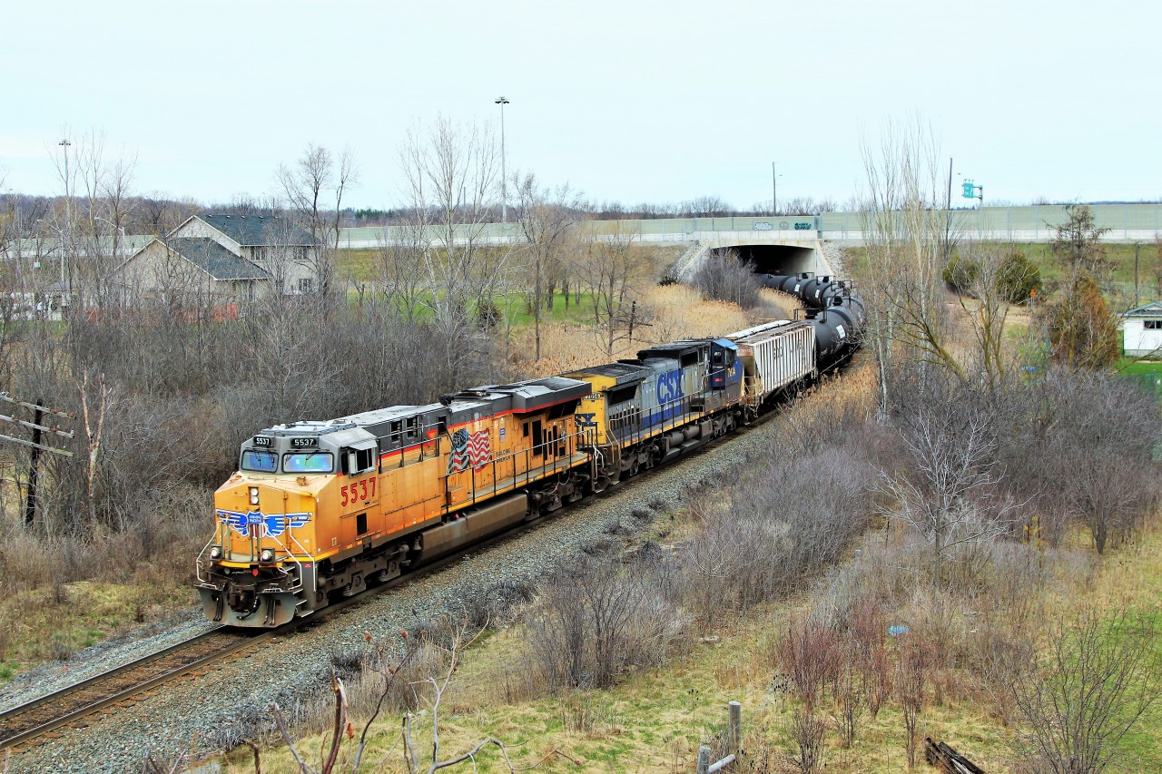 I followed this CP 646 from Puslinch at MM44 on the Galt sub. all the way to this location on the Hamilton Sub. on a beautiful Sunday afternoon and was surprised not to find not another photographer at any of the crossing I visited. Here, off the Newman Street bridge, UP 5537 with CSX 7814 appears from under the highway 6 bridge on its way south to Hamilton.