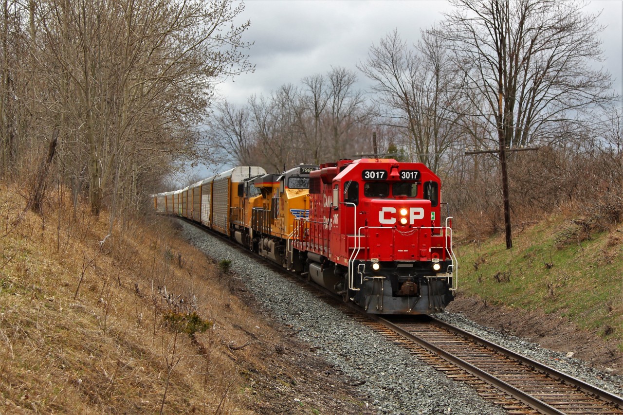 I faintly heard through the static on the scanner about the Puslinch Mile Board so off I went to see what was up. Around the bend comes CP 244 led by GP38AC, CP 3017 looking all shiny and new, with a pair of Union Pacific locomotives for added power in UP 7986 and UP 3997 with 6800 feet of auto racks in tow.