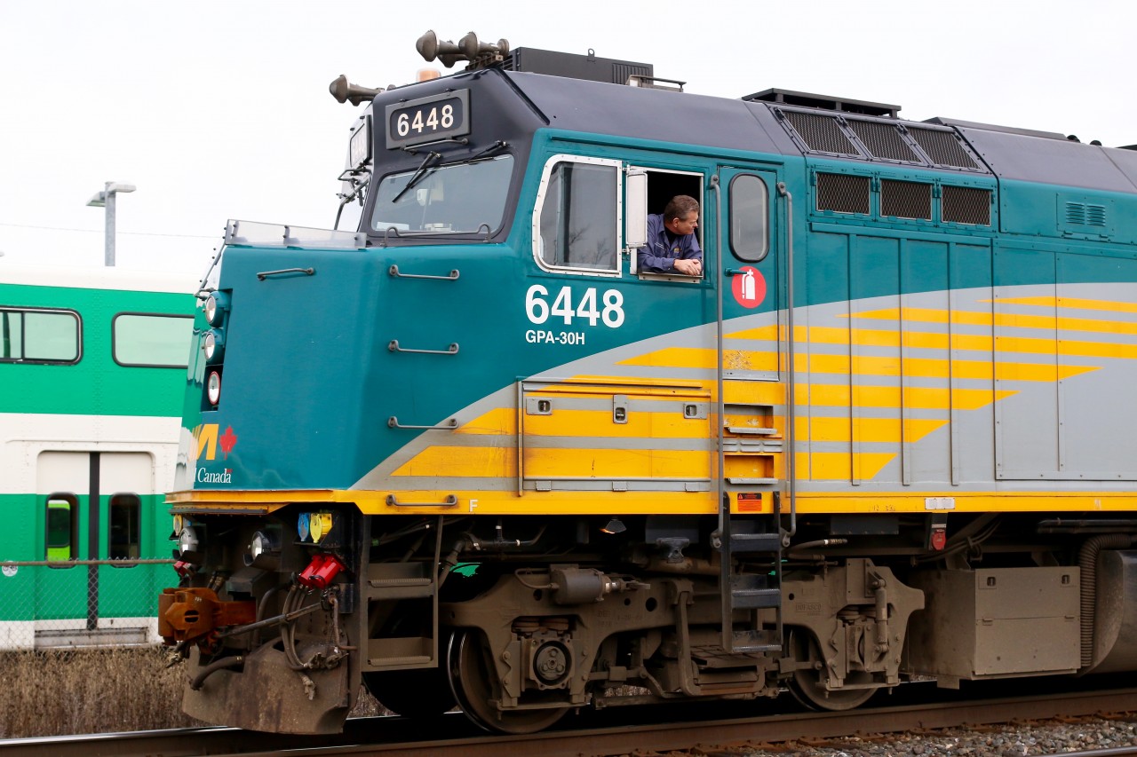 One of the head end crew members of train 85 keeps a watchful eye on passengers as they board the train at Georgetown station. This was one of those days when the train boarded on the north track, rather then the south. It's always nice to included "railroad people" in candid shot.