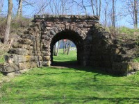 Stone Arch Tunnel, dated 1877. Located on the former Great Western Railway mainline, between St. George and Paris Junction. This was built to allow the farmer, who owned the land, access to his fields to the south.

This line was built in 1853, the line was closed by Canadian National in 1932 and the rails lifted, from Paris to St. George in 1938.

Taken on private property with the owner's permission.