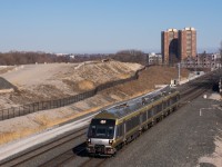 In the middle of a 25 minute, 15 mile trip to Toronto Pearson International Airport, Nippon-Sharyo DMU-A 1009 leads train 4087 through the plant at Humberview on number 3 track. This view will change in the coming years as work to build the fourth track on the Weston Sub occurs in addition to tunnel work to allow the extra track under Highway 401. Finally, under the giant mound of fill is the future site of the maintenance and storage facility at Resources Road for the electrified UP Express.