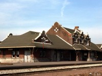 The old Michigan Central Railroad station along Conrail's CASO Sub is shown in Windsor in March 1977. It was built in 1911 to serve the MCRR's passenger trains and later hosted those from Canada Southern (CASO), New York Central, Penn Central and Amtrak in the Conrail era, until 1979. It survived until 1996 when it was destroyed by arson. Van de Water Yard and the Detroit River Tunnel are a short distance off to right.