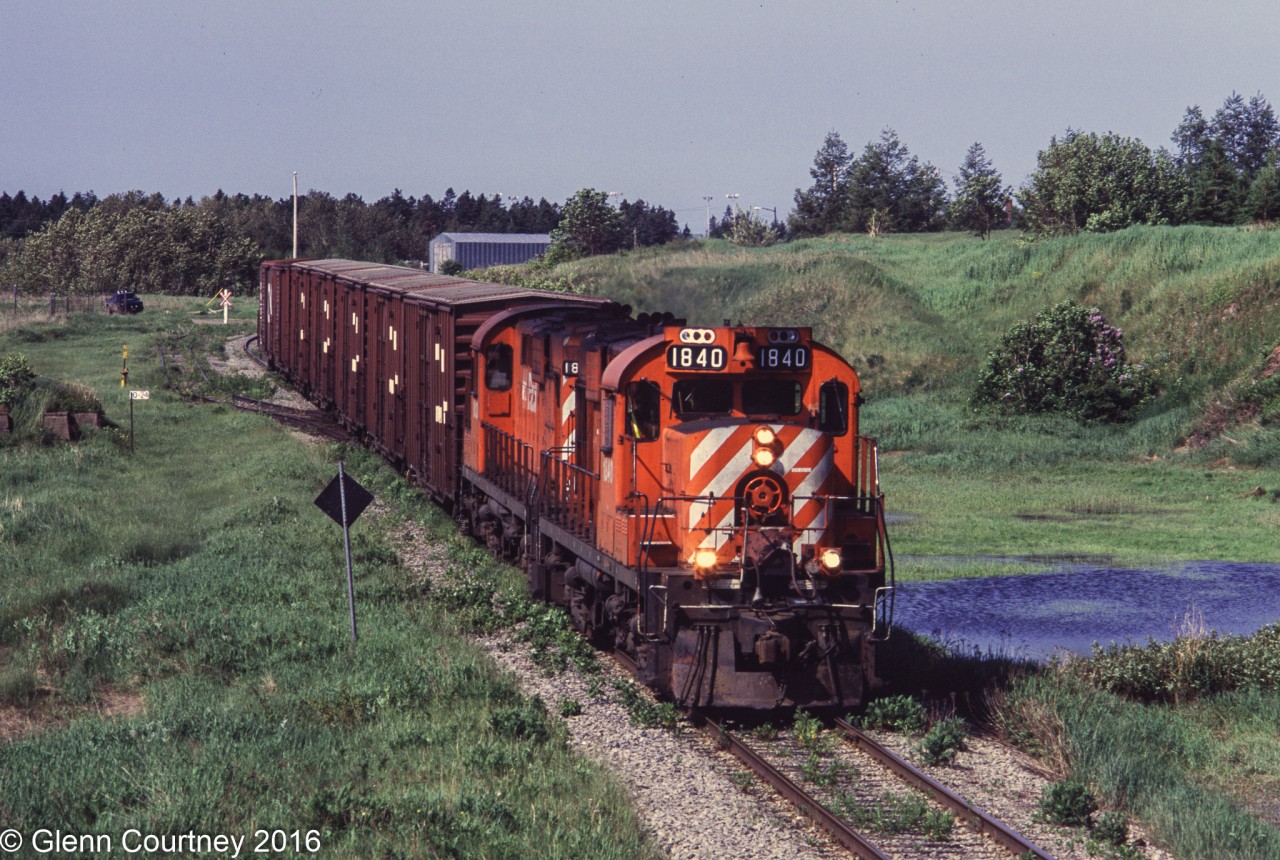 CBC train 592 is heading east to Gaspe with empty boxcars for copper anode loading.  They will return later in the day with loads. The train has just been scooped here by the Chaleur, also heading east to Gaspe.