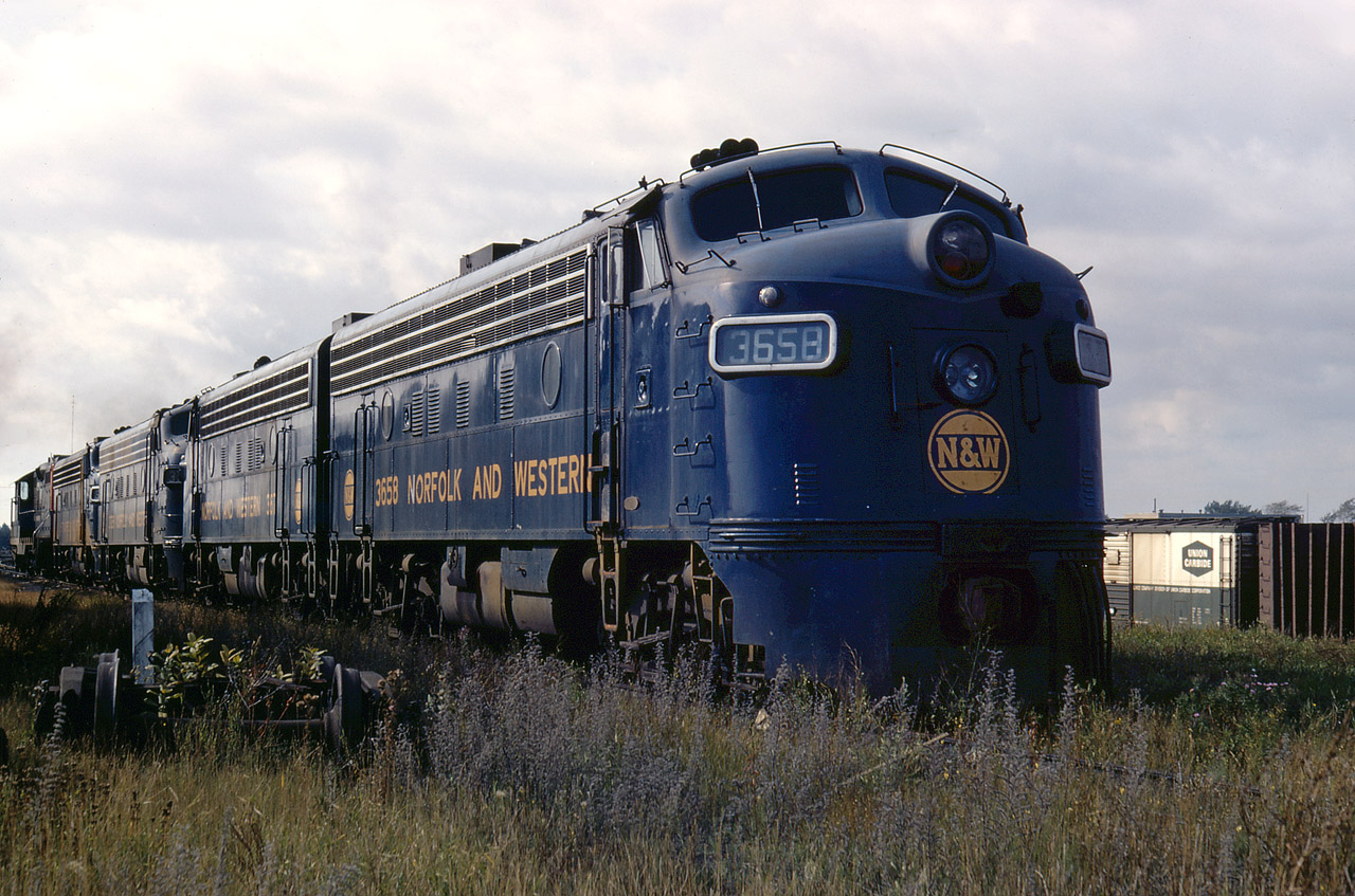 In the spring and summer of 1967, CN found a need to lease about 25 units. Along with some B&LE F7A and F7B’s, they also leased a dozen DM&IR SD9’s, two former NYC GP9’s, and 5 of the Canadian-assigned N&W cab units. Doug has captured 4 of the N&W units after they were off-lease and returned for joint inspection at Fort Erie shop. It should be noted that N&W only had 11 cab units plus GP7 3453 for Canadian use, so obviously they were experiencing a slowdown that summer.  The lease was a very convenient situation for CN, since the F units were based out of the Fort Erie shop anyway. They were basically used in the Toronto/Sarnia/Windsor/Fort Erie triangle and were not known to have travelled north to Capreol or North Bay, or anywhere further east than Belleville or Brockville. They were mixed with any motive power that was available, including Ontario Northland power that was utilized on Toronto to Niagara Falls and Toronto Fort Erie trains.