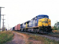 
Here's an example of knowing what went west on NS 327 the day before, and having the good fortune to be able to shoot that power coming back on 328. A pair of CSX units, 208 and 8758 bring a not-so-large eastbound through Paris Jct. on a warm but overcast morning. If you were an NS employee based out of St. Thomas, you had the luck of the roulette wheel when it came to motive power on these trains.