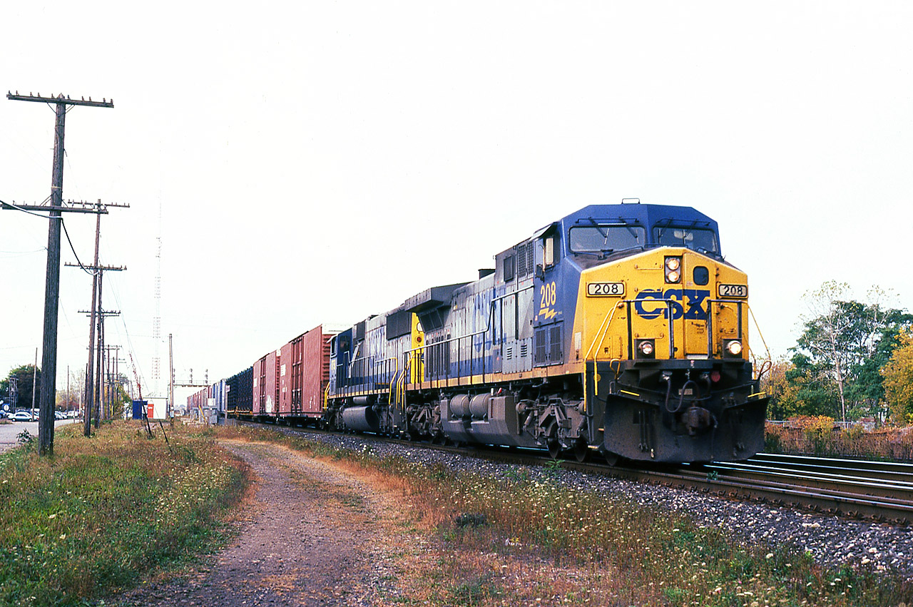 Here's an example of knowing what went west on NS 327 the day before, and having the good fortune to be able to shoot that power coming back on 328. A pair of CSX units, 208 and 8758 bring a not-so-large eastbound through Paris Jct. on a warm but overcast morning. If you were an NS employee based out of St. Thomas, you had the luck of the roulette wheel when it came to motive power on these trains.