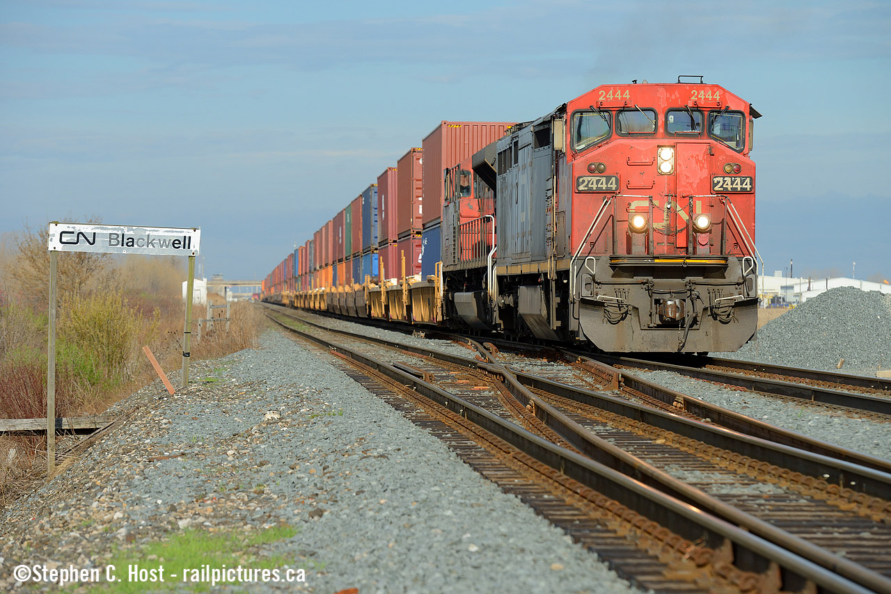 As clouds rapidly move in, CN 148 gets under way after a lift in Sarnia's "A" yard, with a classically Canadian Cowl unit in the lead.