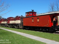 <b>This caboose is on display, in Downtown Guelph (see map) on April 22 and 23 2017</b> and the members of the <a href=http://www.ghra.ca target=_blank>Guelph Historical Railway Association</a> will be on hand to give tours to all visitors. Railway history will be on display inside this museum on wheels, and with thanks to the Ontario Southland Railway and the Guelph Junction Railway, who moved the car for us downtown for the weekend. All are welcome. Doors Open Guelph is on Saturday the 22nd and from 9 AM to 5 PM we'll be giving group tours throughout the day. Sunday will be much quieter but someone should be there during the day (and at night for security - but if you drop by in the evening knock for a tour!)<br><br>In this photo, OSR is dropping the Caboose off in the siding for a Doors Open Guelph event in 2010. We participate in this event every three or so years, and work to put our caboose on display as often as we can. If you are interested in getting involved with us, we could use your help! Join us by visiting <a href=http://www.ghra.ca target=_blank>www.ghra.ca</a> and click "interested in learning more about us". For those who prefer to support at arms length, and donate, we accept donations by mail (see website) or at <a href=https://www.canadahelps.org/en/charities/guelph-historical-railway-association/ target=_blank> Canada Helps</a>. Thank you - without your support projects like this would never happen. <br><br><b>Nighttime bonus for Saturday and Sunday evening:</b> For photographers who come after dusk - bring your tripod - the Caboose is lit up ONLY with lanterns (proper marker lights and lanterns outside and inside) - looks and smells just like it did! A real treat - don't miss out, come visit - and don't be afraid to knock- we have people on-site overnight and they are happy to have evening visitors. Don't be shy!
