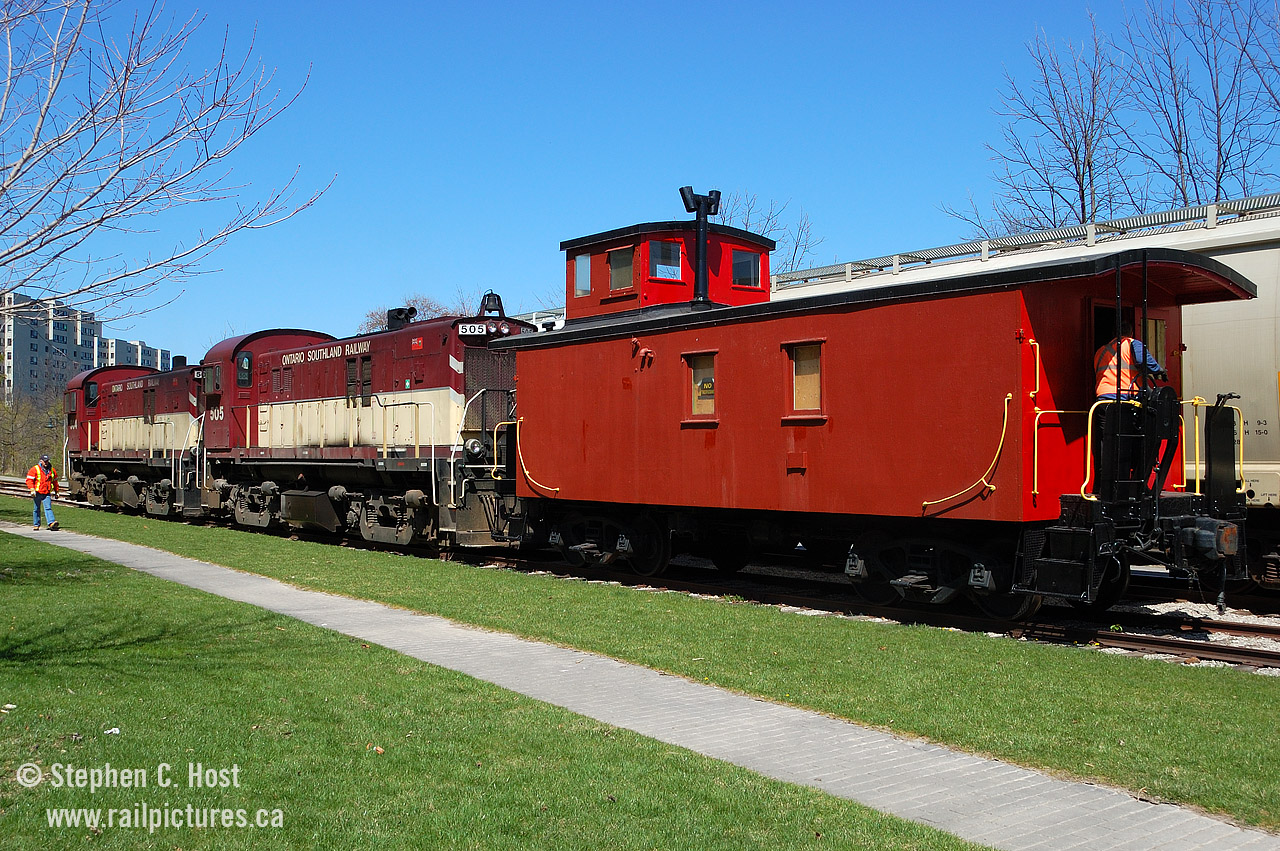 This caboose is on display, in Downtoen Guelph (see map) on April 22 and 23 2017 and the members of the Guelph Historical Railway Association will be on hand to give tours to all visitors. Railway history will be on display inside this museum on wheels, and with thanks to the Ontario Southland Railway and the Guelph Junction Railway, who moved the car for us downtown for the weekend. All are welcome. Doors Open Guelph is on Saturday the 22nd and from 9 AM to 5 PM we'll be giving group tours throughout the day. Sunday will be much quieter but someone should be there during the day (and at night for security - but if you drop by in the evening knock for a tour!)
In this photo, OSR is dropping the Caboose off in the siding for a Doors Open Guelph event in 2010. We participate in this event every three or so years, and work to put our caboose on display as often as we can. If you are interested in getting involved with us, we could use your help! Join us by visiting www.ghra.ca and click "interested in learning more about us". For those who prefer to support at arms length, and donate, we accept donations by mail (see website) or at  Canada Helps. Thank you.