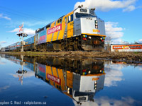Before heading for Groceries, my daughter and I watched #87 go by with newly wrapped 6454 in the lead and I took full advantage of a typical springtime puddle. :)

