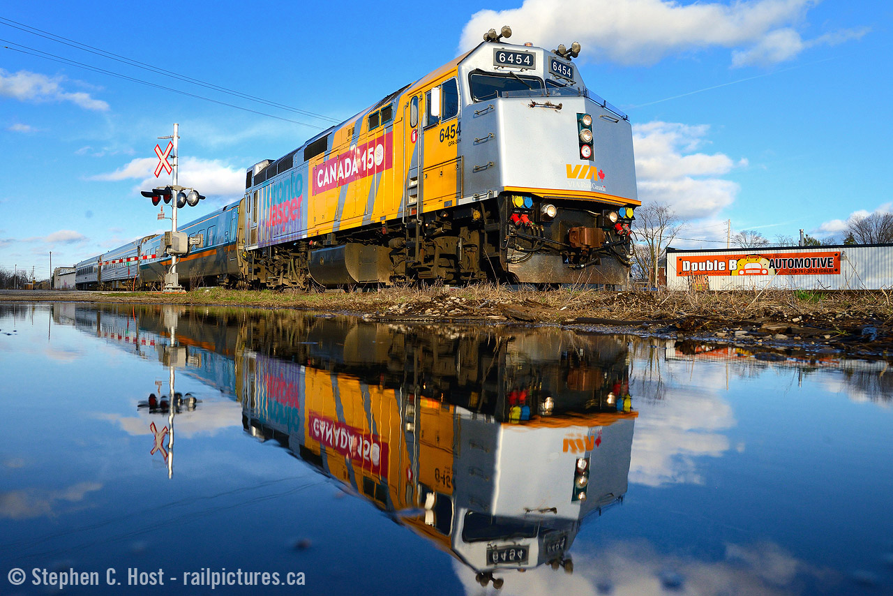 Before heading for Groceries, my daughter and I watched #87 go by with newly wrapped 6454 in the lead and I took full advantage of a typical springtime puddle. :)