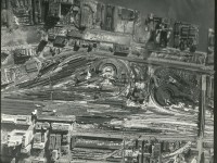 Aerial photo of Toronto rail yards for CN and CP. I believe this is from the 1930's as the freight yards on front and King are still present. Steam exhaust can been seen in several locations. This is 1 of 4 picture going from West to East. I have an enlargement of this one.