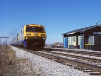 VIA 6920, with Windsor-Toronto train 72, blows by the old Stoney Point station at mile 81.9 on the CN's Chatham Sub. Three years later, CN would lift the eastbound main and in 1992 CN removed the fire damaged station.