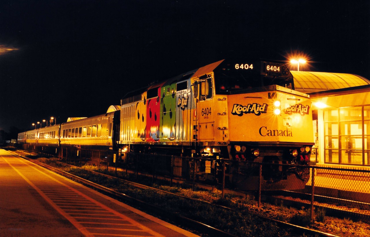 VIA 6404 in the short-lived Kool Aid wrap has just arrived at Oakville with a string of four LRC cars from Ottawa and Toronto.  After offloading its passengers, this train deadheaded in reverse to the TMC.  I can't remember the exact train number, but for a short time, VIA extended this train from Ottawa along with express train #67 from Montreal "The Metropolis" (which still used LRC locomotives at the time) form Toronto Union to Oakville.