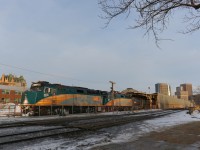 The westbound Canadian just arrived at Winnipeg in the early morning.  At left, gothic roof of the Fort Garry Hotel can be seen.