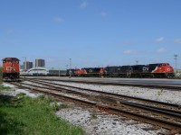 CN train 509, pulls into London Yard with a nice batch of power. CN 2139, IC 1007, CN 2628, and CN 7230, with a decent size train. 

(Once it cleared the crossing at Egerton St, a westbound train with CN 2100, CN 5439, & CN 2183, go by on the North track, and I warned a pedestrian not to cross as another train was was coming, and he thanked me, cause he had his headphones in and was going to run. Only saw the other train, as I was back a bit and saw the train coming over the headend cars of Frame Flat cars)