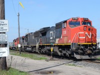 CN 509 starts pulling down into track 7 at London yard, and warning signs fill up the Light post on the westside of Egerton St.