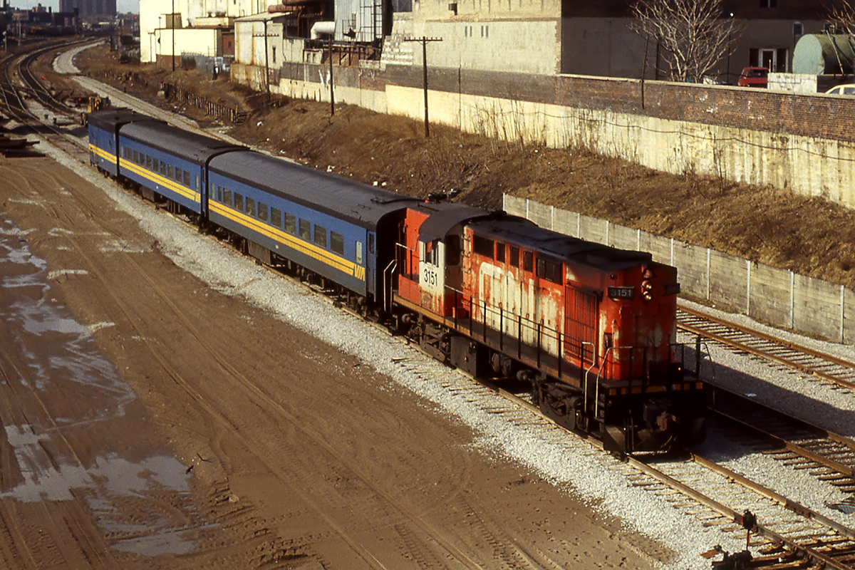 Power up front, steam generator on the back as what I believe is VIA coming down the back way into Union Station.