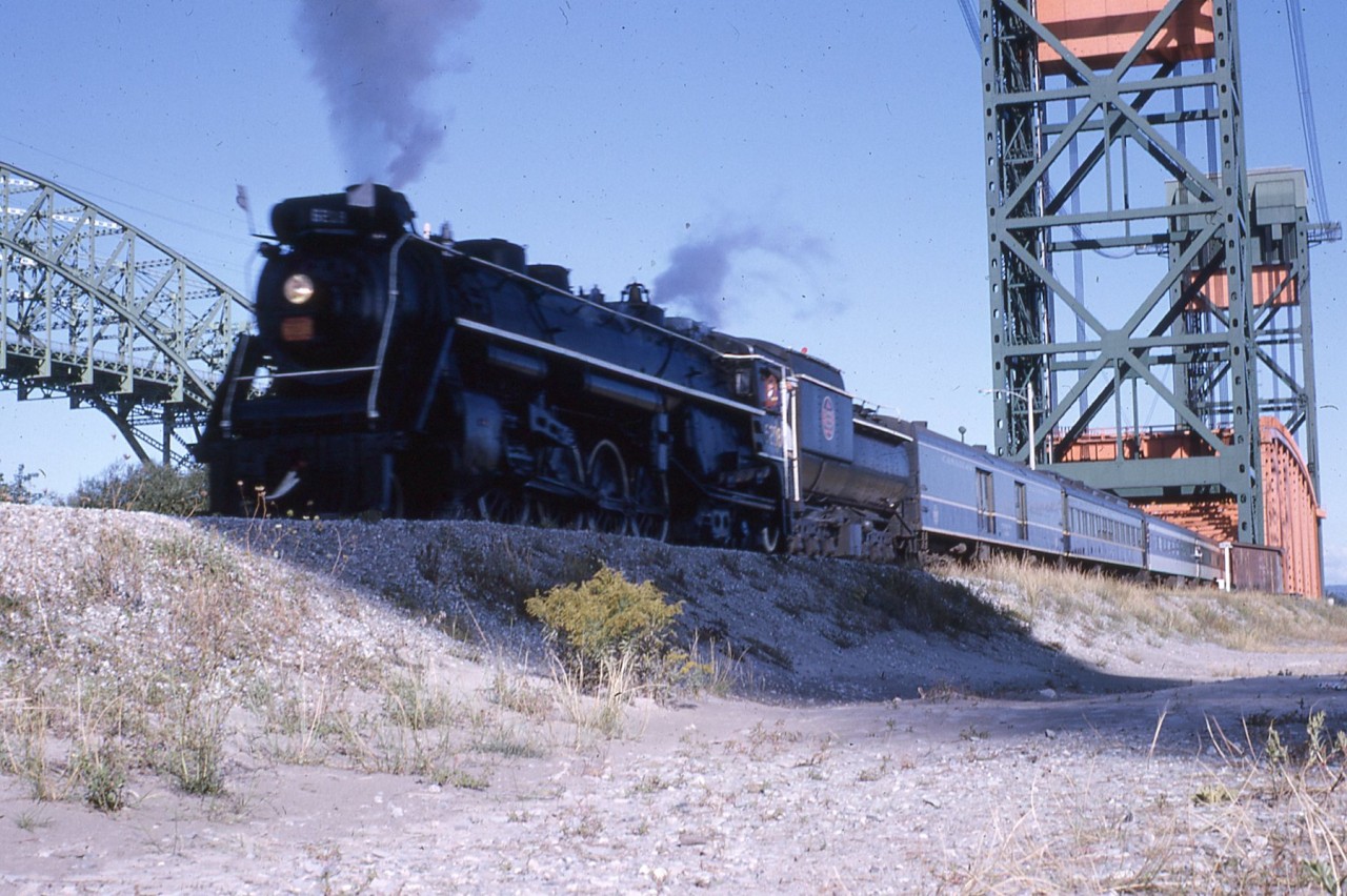 I don't know the year, late 1960s, we were on so many of the CN 6218 excursions.  Location is obvious to many, going over the Burlington Canal Left Bridge for a runpass when the Beach Sub. was still intact...and had a reasonable speed limit, judging by the slight blur of the engine marker.  I think the shadow was caused by the locomotive exhaust.
