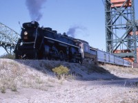 I don't know the year, late 1960s, we were on so many of the CN 6218 excursions.  Location is obvious to many, going over the Burlington Canal Left Bridge for a runpass when the Beach Sub. was still intact...and had a reasonable speed limit, judging by the slight blur of the engine marker.  I think the shadow was caused by the locomotive exhaust.