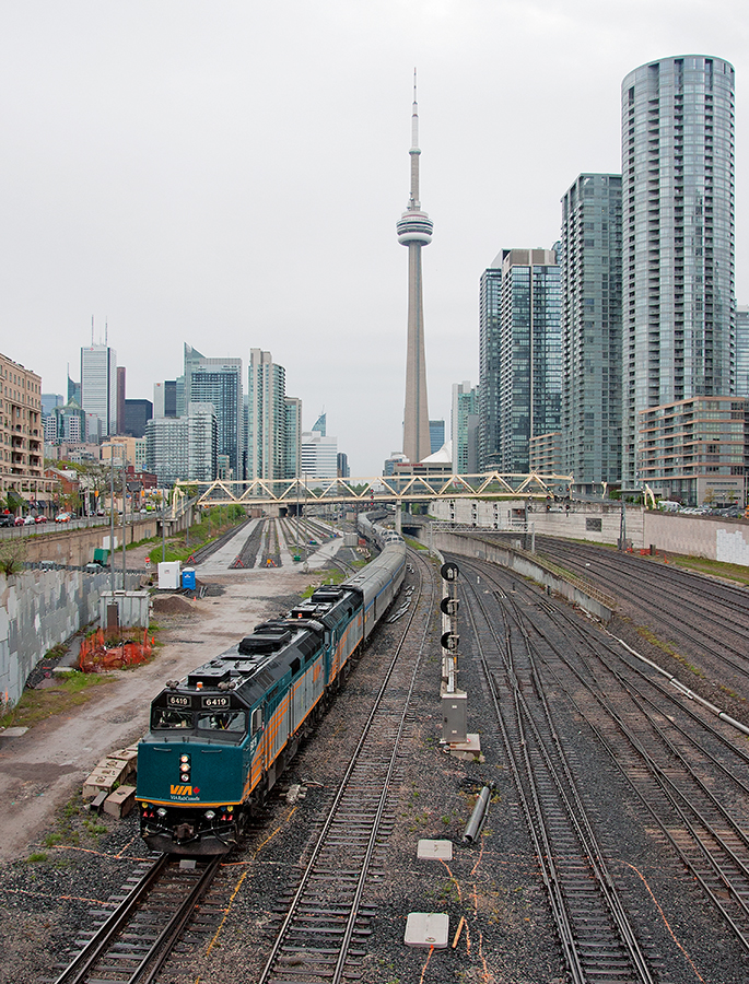 A late night arrival into Toronto last night offered this view this morning as a very late Canadian snakes past city skyline of Toronto for points west.
