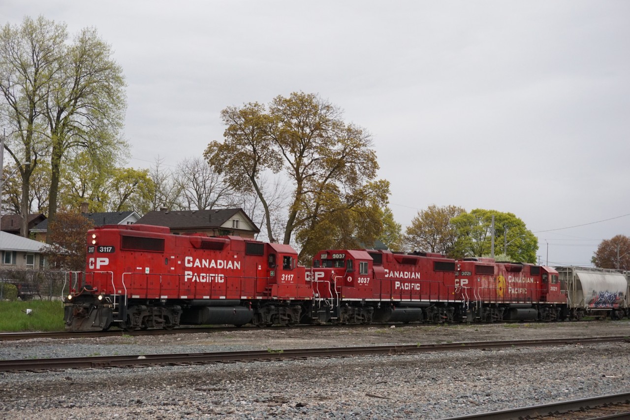 T69 is leaving Cambridge with a trio of GP38-2s with 3117 leading long hood forward.