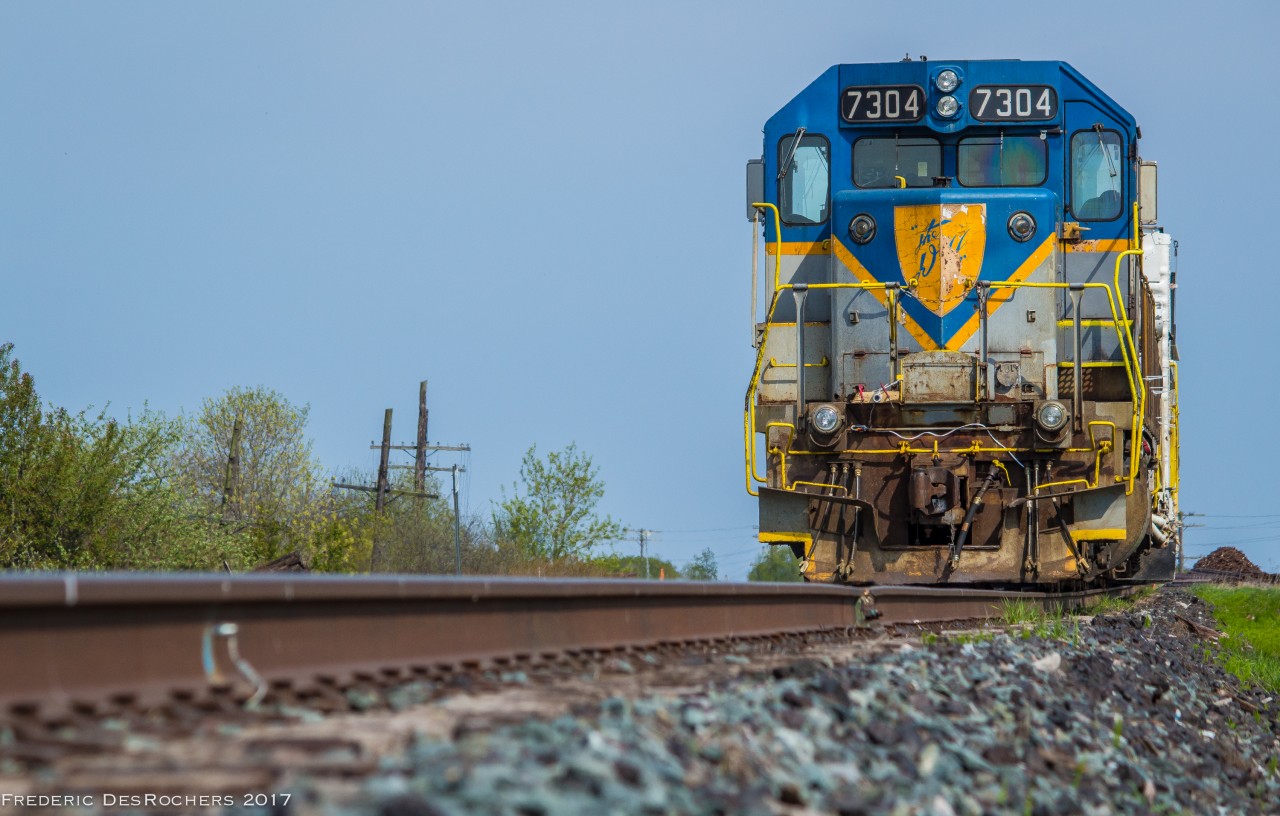 D&H 7304 leading a weed sprayer train, idles away in the Lovekin siding, awaiting a new crew that will bring it to Toronto.