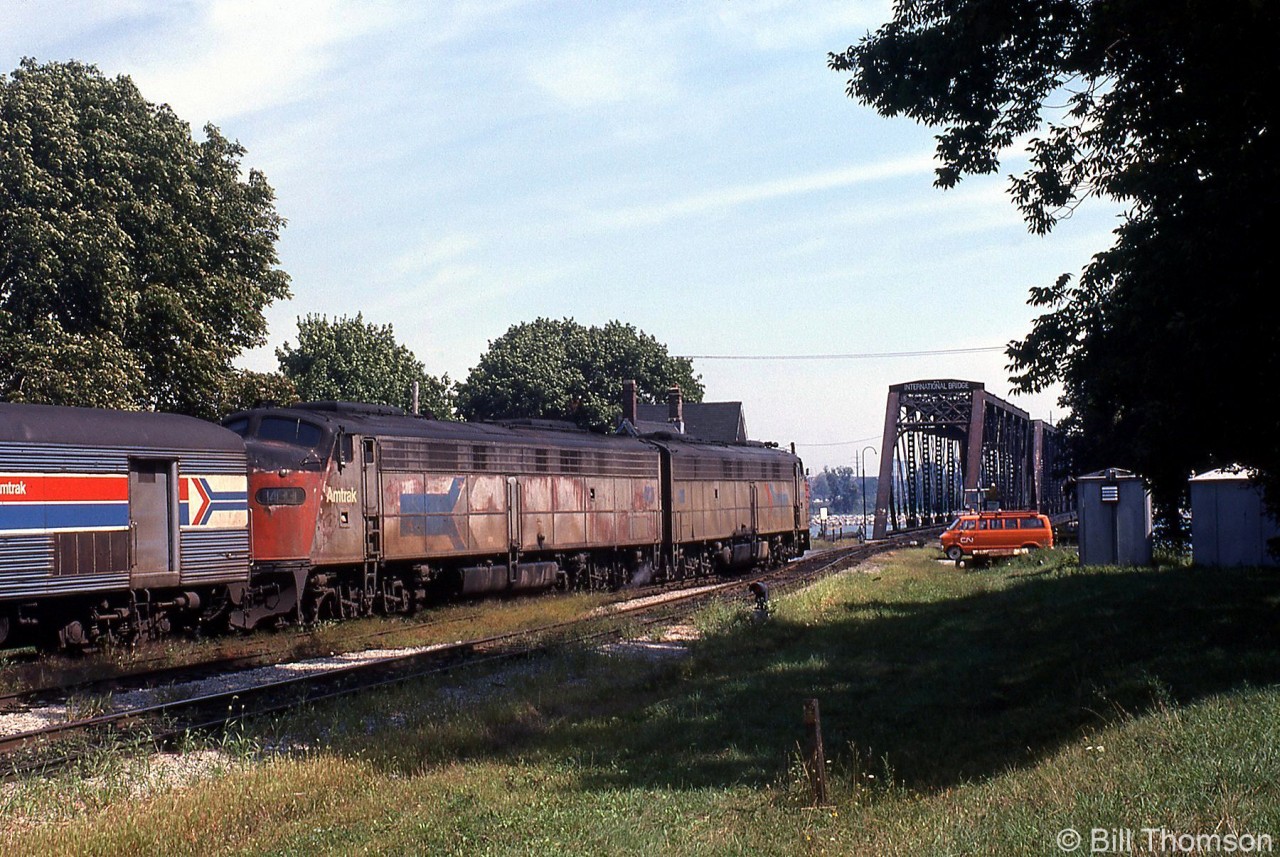 Amtrak's Niagara Rainbow is shown in Fort Erie, about to cross the International Bridge from Canada into the USA in September of 1978. An old pair of well-worn EMD E-units are today's power, typical of the early Amtrak-era equipment that was mainly hand-me-down locomotives and passenger cars from railroads wanting out of the passenger train business.