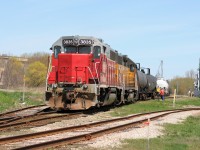 Goderich-Exeter Railway train X580 is seen switching Elmira, Ontario with GEXR GP38AC 3835 and LLPX GP38AC 2210 on a sunny Saturday morning. 