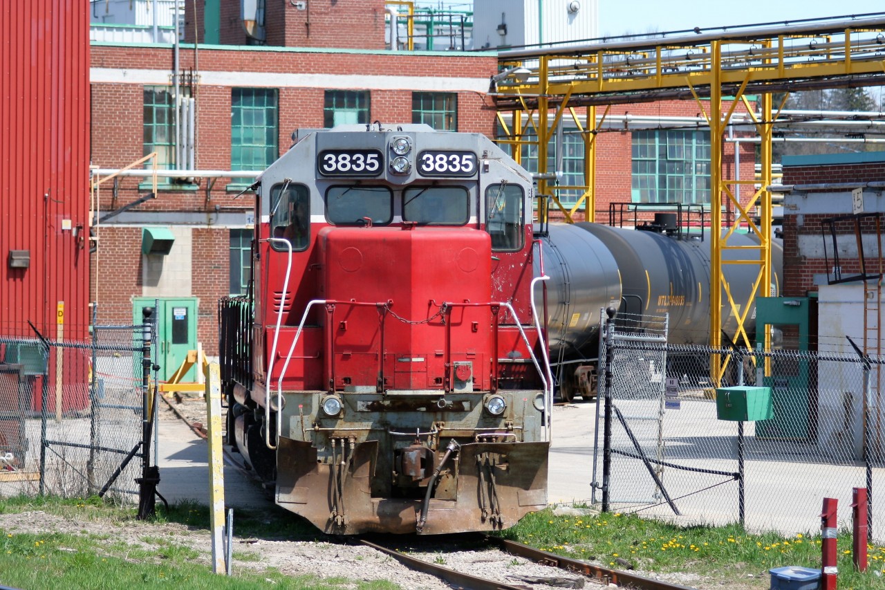 Goderich-Exeter Railway train X580 is viewed switching tankers at the Chemtura facility in Elmira, Ontario with GEXR GP38AC 3835 and LLPX GP38AC 2210.