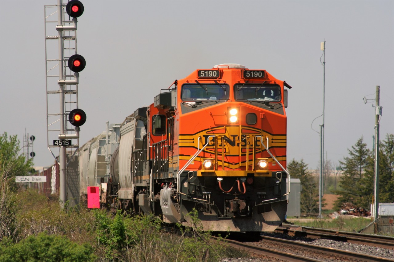 BNSF C44-9W 5190 and another BNSF unit lead an eastbound CN freight by the rarely photographed Blain crossover on the Dundas Subdivision.