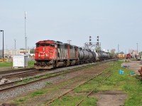 A westbound CN train with SD60F 5539 rolls through London Junction towards Sarnia with a sister draper unit. 