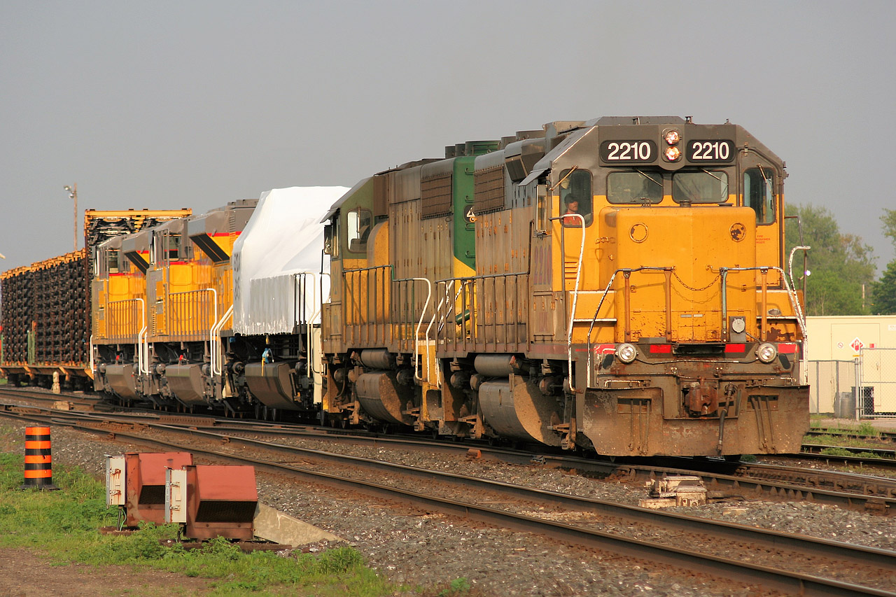 GEXR train 433 is seen backing its cars into the CN yard at London, Ontario with LLPX GP38AC 2210 and GEXR GP40 4046. The trains consist included new Union Pacific units from the now closed GMDD plant in London and new car frames from the former Budd Canada factory in Kitchener.