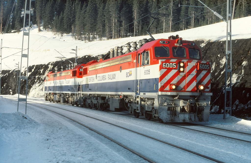 On the BC Rail, Tumbler sub, light pusher power heading north after pushing a loaded coal train "up the mountain".  This view is at Wolverine siding at approximately mile 48. Latitude & Longitude what I have shown may not be correct.