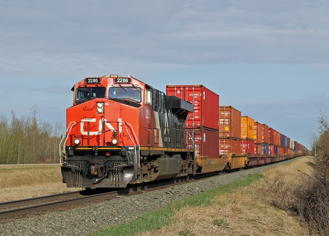 ES44DC CN 2286 heads an intermodal east passed North Cooking Lake.
