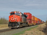 ES44DC CN 2286 heads an intermodal east passed North Cooking Lake.