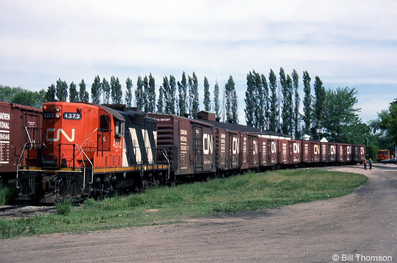 The H.J. Heinz Co. plant in Leamington Ontario was the most significant rail customer in the area, located at the end of the 13.8 mile Leamington Sub that branched off the CASO at Comber. Here, CN GP9 4373 switches a healthy cut of insulated boxcars for Heinz on May 2nd 1985. Unfortunately the plant, which opened in 1909, was closed by Heinz in 2014 (but was subsiquently sold to Highbury Canco for continued operation).