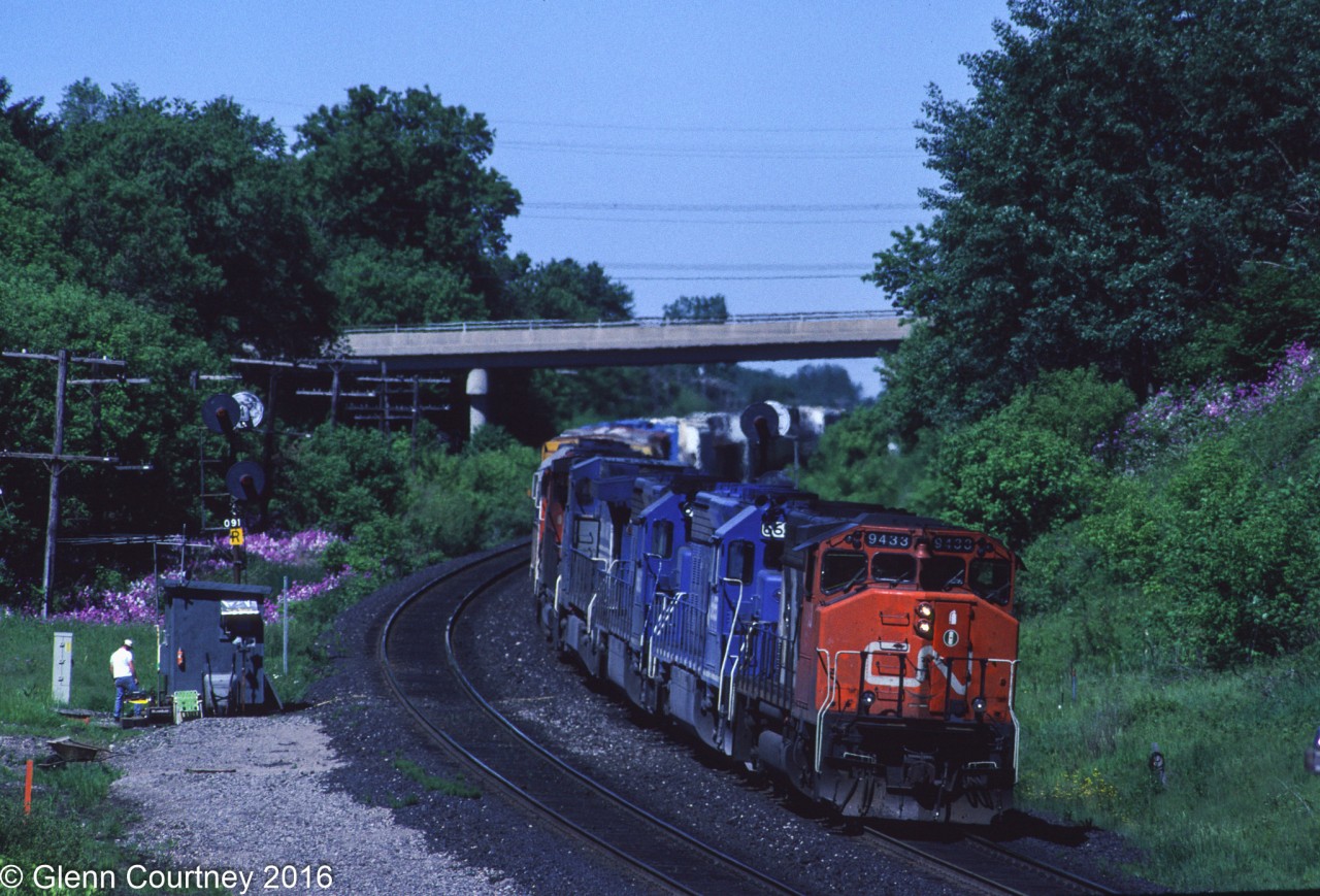 Train #386 drops downgrade at Copetown with a pair of CN units bracketing a trio of Conrail units.