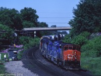 Train #386 drops downgrade at Copetown with a pair of CN units bracketing a trio of Conrail units.  
