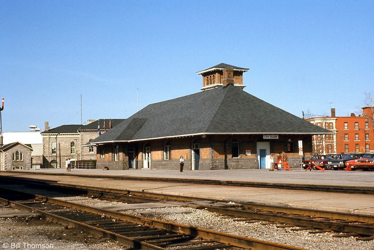 CN's Guelph Station is viewed from the south side of the tracks in 1973. Note the order board at the station, still in use at the time. Built by the Grand Trunk Railway in 1911, the station continues in use as a passenger station for VIA and GO trains operating on the GEXR (former CN) Guelph Sub.